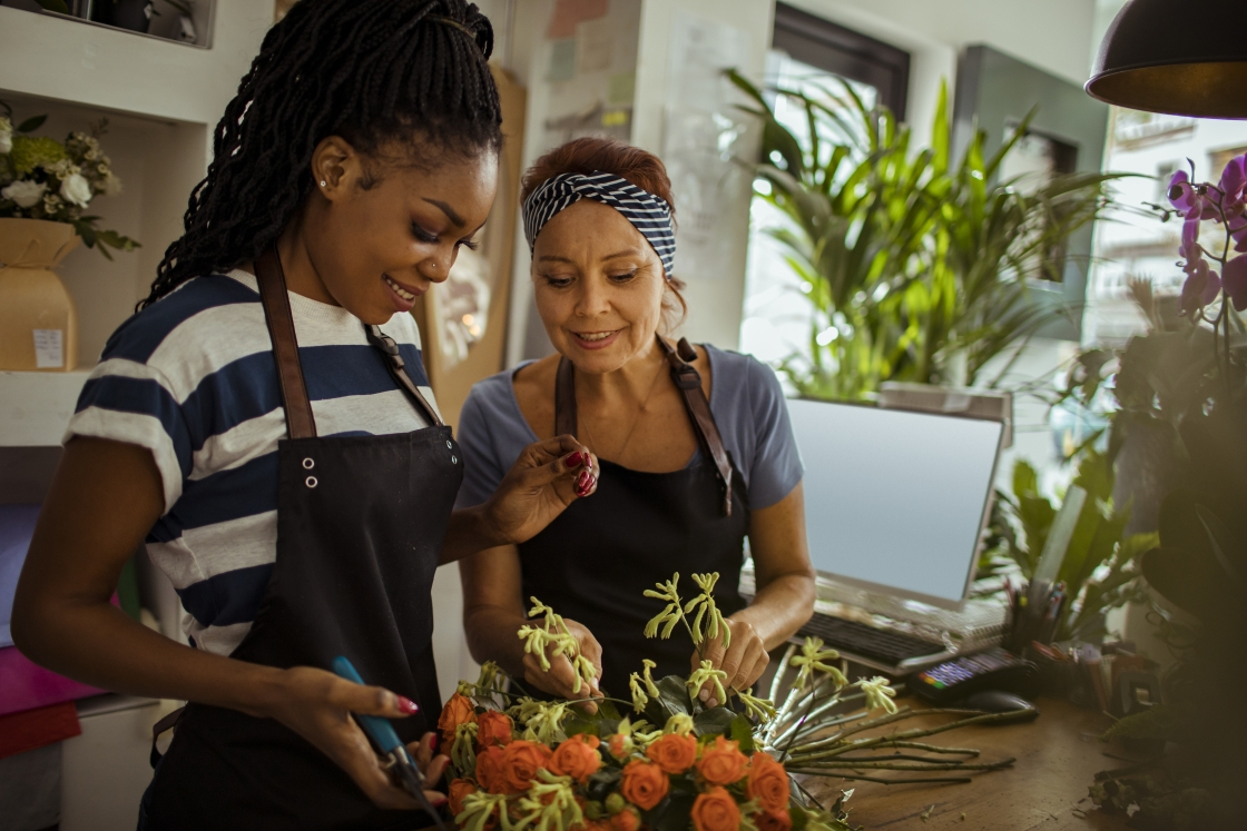 Two women working in a flower shop