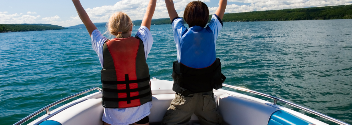 to kids at the front of a speed boat