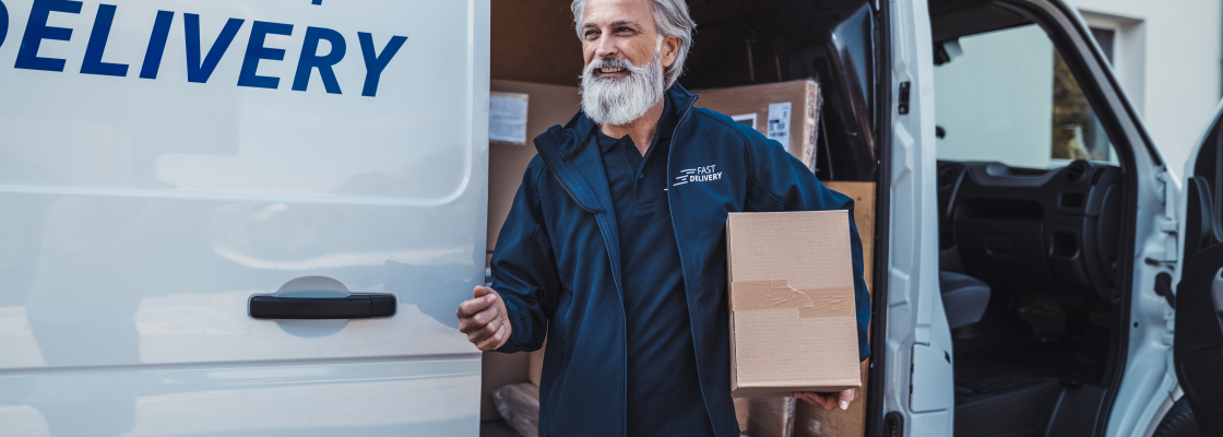 male delivery driver holding package