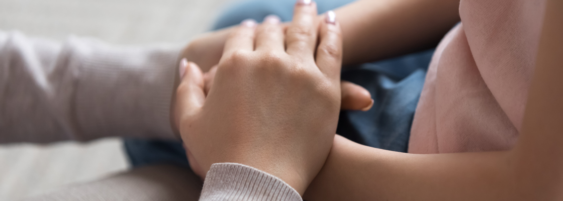 Mom holding daughter's hands